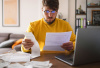 man looking at paperwork