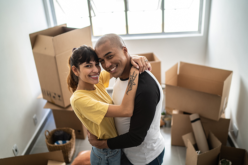 Happy Couple with moving boxes