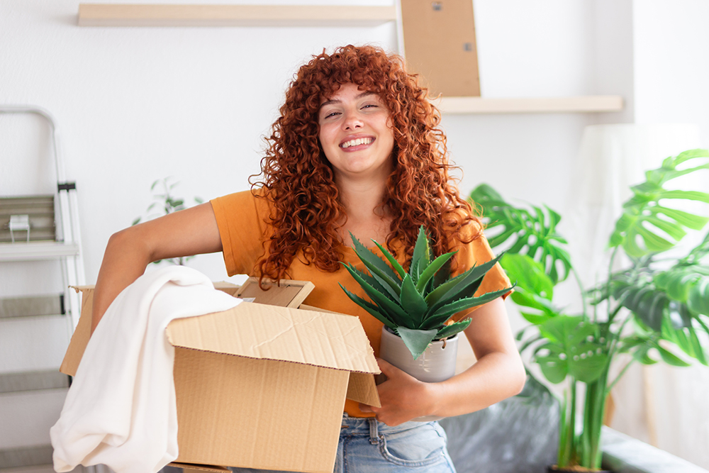 Women with a plant and box